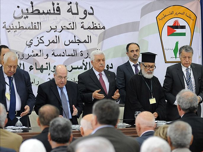 A handout picture released by the Palestinian president's Press Office on April 26, 2014 shows Palestinian Authority President Mahmud Abbas (C) standing with members of the Palestine Liberation Organisation (PLO)'s Central Council as they pray during a meeting in the West Bank city of Ramallah. Palestinians will never recognise Israel as the "Jewish state," Abbas said, as his leadership convened to chart a course of action after Israel halted peace talks. "In 1993 we recognised Israel," Abbas told members of the PLO, adding that the Palestinians should not be forced to go a step further and recognise Israel's religious identity. AFP PHOTO / PPO / THAER === RESTRICTED TO EDITORIAL USE / MANDATORY CREDIT "AFP PHOTO / PPO / THAER GHANAIM" NO MARKETING / NO ADVERTISING CAMPAIGNS / DISTRIBUTED AS A SERVICE TO CLIENTS ===