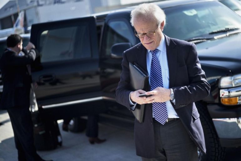U.S. Special Envoy for Israeli-Palestinian Negotiations Martin Indyk checks his mobile phone while waiting for U.S. Secretary of State John Kerry to board his plane at Ben Gurion International Airport in Tel Aviv January 6, 2014. REUTERS/Brendan Smialowski/Pool