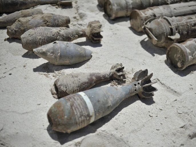 A handout photograph released by the African Union-United Nations Information Support team on 10 May 2013 shows unexploded ordinances (UXOs) lying on the ground waiting to be placed in a pit for detonation at a location near Mogadishu, Somalia, 09 May 2013. Over 200 kilos of unexploded ordinances (UXOs), captured from al-Shabaab militants, are destroyed outside of Mogadishu at a safe location. A team, aided by the UN Somalia Mine Action agency and consisting of soldiers from Burundi and Uganda, dispose of weapons on a weekly basis in order to ensure the weapons no longer pose a risk to civilians. EPA/TOBIN JONES
