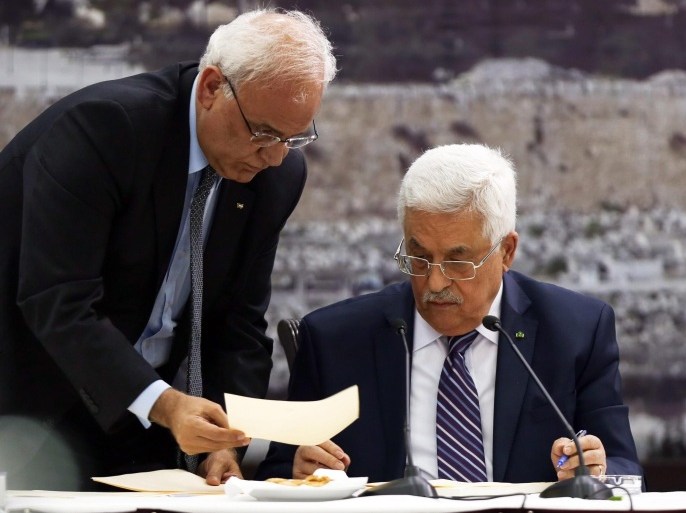 Palestinian President Mahmoud Abbas (R) and his top negotiator Saeb Erekat (L) signing 15 applications during a meeting of the Palestinian leadership to discuss Israeli-Palestinian peace talks at his headquarter in the West Bank town of Ramallah, 01 April 2014. President Abbas says the Palestinians would seek to join 15 United Nations agencies after Israel failed to release prisoners under US-sponsored peace talks. 'The Palestinian leadership has unanimously approved a decision to seek membership of 15 UN agencies and international treaties, beginning with the Fourth Geneva Convention,' Abbas said, referring to the treaty on protecting civilians in conflict zones.
