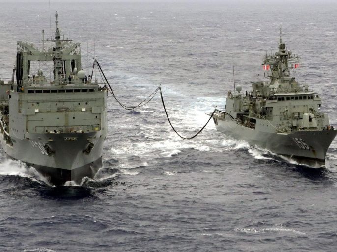 A handout picture made available by the Australian Department of Defense (DOD) on 05 April 2014 shows the Royal Australian Navy (RAN) ship HMAS Toowoomba (R) conducting a Replenishment at Sea with the RAN ship HMAS Success whilst on Operation 'Southern Indian Ocean', the search for the Malaysian Airways flight MH370, which went missing on 08 March, in the Indian Ocean, on 02 April 2014. The multinational operation in the Indian Ocean is on 05 April in its 19th day, with the 217,000-square-kilometre search zone shifting slightly north of previous unsuccessful searches. The search is intensifying as time to find the black box flight recorder is running out. The Australian Transport Safety Bureau said it is continuing to work on narrowing down the area where the plane could have hit the water using data supplied by an air crash investigation team with analysts from Malaysia, the United States, Britain, China and Australia. EPA/ABIS Chris Beerens / DOD