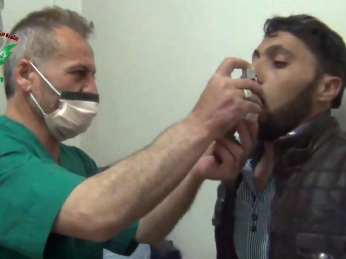 In this image taken from video obtained from the Shaam News Network, posted on April 18, 2014, an anti-Bashar Assad activist group, which has been authenticated based on its contents and other AP reporting, a Syrian man is treated with an inhaler in Kfar Zeita, a rebel-held village in Hama province some 200 kilometers (125 miles) north of Damascus. Syrian opposition activists and other witnesses tell The Associated Press that Syrian government forces have attacked rebel-held areas with poisonous chlorine gas in recent months. They say the attacks left scores of men, women and children coughing, choking and gasping for breath. The reports have been denied by the Syrian government and have yet to be confirmed by any foreign country or international organization. But if true, they highlight the limitations of the global effort to rid Syria of its chemical weapons. (AP Photo/Shaam News Network)