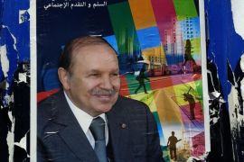 A poster of Algerian president Abdelaziz Bouteflika and candidate in the upcoming presidential elections, hangs on a building in the center of Algiers on April 15, 2014. Final campaign rallies were held for Algeria's presidential election on the weekend after the incumbent Bouteflika and his only real rival Ali Benflis waged a war of words. AFP PHOTO/PATRICK BAZ