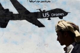 A Yemeni man passes a graffiti depicting a US drone at a street in Sanaa, Yemen, 06 November 2013. Reports state the US launched at least 92 drone strikes on suspected al-Qaeda militants in Yemen between 2002 and mid-2013, killing between 680 and 880 people, including at least 60 civilians.