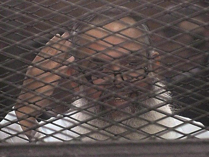 Egypt's Salafi leader and former presidential candidate Hazem Salah Abu Ismail looks on from the defendant cage during his trial in Cairo December 19, 2013. REUTERS/Stringer (EGYPT - Tags: POLITICS CIVIL UNREST CRIME LAW)