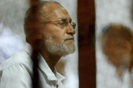 Leader of Egypt's Muslim Brotherhood Mohammed Badie sits inside a defendants cage during his trial in Cairo, Egypt, Wednesday, April 30, 2014. (AP Photo/Ahmed Omar) EGYPT OUT
