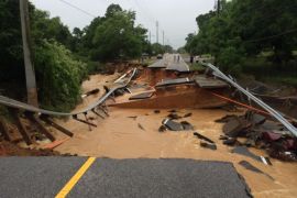 In this image provided by Brantly S. Keiek shows a section of the Scenic Highway that collapsed due to heavy rain in Pensacola, Fla., Thursday, April 30, 2014. Heavy rains and flooding have left people stranded in houses and cars in the Florida Panhandle and along the Alabama coast. According to the National Weather Service, an estimated 15-20 inches of rain has fallen in Pensacola in the past 24 hours. (AP Photo/ Brantly S. Keiek)