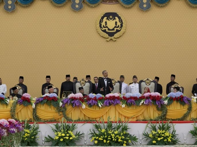 U.S. President Barack Obama, center, speaks during a state dinner with Malaysian King Abdul Halim Mu'adzam Shah, seated third from left, Queen Haminah, seated third from right and Malaysian Prime Minister Najib Razak, seated second from left, at the King's Palace or Istana Negara in, Kuala Lumpur, Malaysia, Saturday, April 26, 2014. The last U.S. president to visit Malaysia was Lyndon B. Johnson in 1966. (AP Photo/Carolyn Kaster)