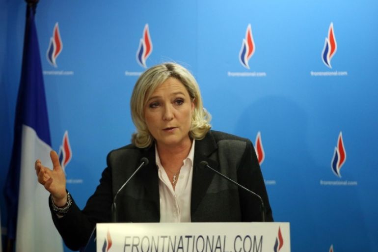 French far-right party Front National (FN) presidente Marine Le Pen speaks at the FN headquarters after the results of the France municpal elections' second round, on March 30, 2014 in Nanterre. French voters went to the polls on March 30 for a second round of local elections following a first round last week that saw the far right make sharp gains against President Francois Hollande's ruling socialists. AFP PHOTO / KENZO TRIBOUILLARD