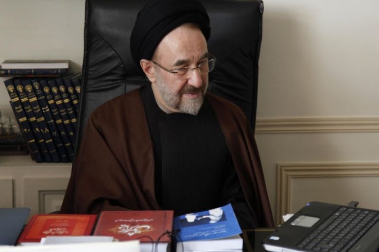 In this undated photo released by office of former Iranian President Mohammad Khatami, Mohammad Khatami, watches a video on his laptop, at his office, in Tehran, Iran. Many reformists are expected to sit out the June 14 voting in a silent protest over the crackdowns that have left them leaderless and demoralized. Others unwilling to boycott the election are rallying around a last-ditch call for help to Khatami, who is seen increasingly as their only credible hope at the ballot box.
