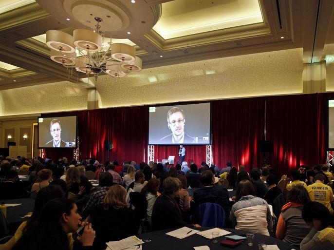 Former NSA contractor Edward Snowden joins a discussion via video link about the US government's use of mass surveillance, as well as its persecution of whistleblowers who seek to tell the truth about human rights violations during the Annual Gathering of Amnesty International themed "Bring Human Rights Home", in Chicago, Illinois 5 April 2014. Three day conference which started on April 4, focuses on strengthening the links between the local and the global aspects of the human rights movement.