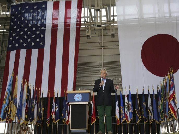 U.S. Secretary of Defense Chuck Hagel delivers his speech to the U.S. military personnel upon his arrival at the U.S. Yokota Air Base on the outskirts of Tokyo, Saturday, April 5, 2014. Against the backdrop of Russia's takeover of Ukraine's Crimean region, Hagel said Saturday that a key message he will deliver to leaders in Tokyo this weekend is that the U.S. is strongly committed to protecting Japan's security. (AP Photo/Eugene Hoshiko)