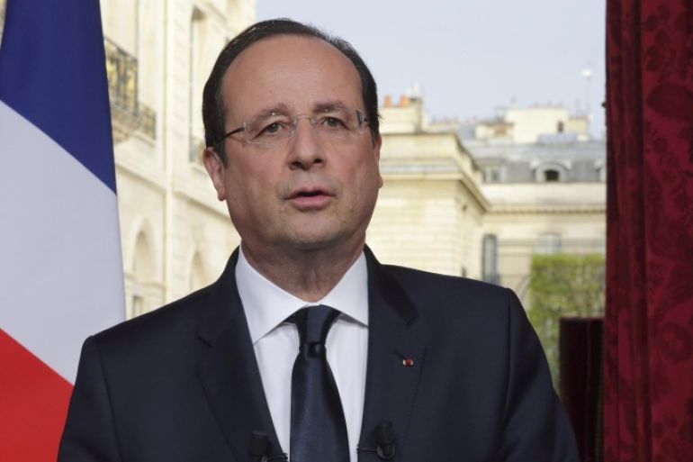 France's President Francois Hollande speaks after he recorded a speech to be broadcast on French television at the Elysee Palace in Paris, March 31, 2014. REUTERS/Philippe Wojazer
