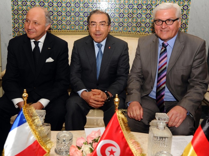 ‪‬ شتاينماير (يمين) وفابيوس (يسار) يتعهدان بدعم الديمقراطية بتونس(غيتي إيميجز)