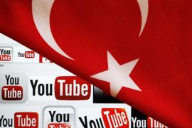 YouTube logos displayed on a laptop screen partially covered with Turkey's national flag in this photo illustration taken in Ankara March 27, 2014. REUTERS/Umit Bektas