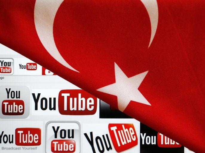 YouTube logos displayed on a laptop screen partially covered with Turkey's national flag in this photo illustration taken in Ankara March 27, 2014. REUTERS/Umit Bektas