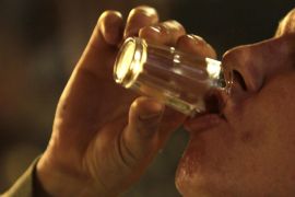 A man drinks a shot of liquor at a bar in Prague September 12, 2012. Fourteen people have died in the Czech Republic and at least 20 are in hospital after drinking bootleg vodka and rum containing methanol, police said on Wednesday, in the worst case of fatal alcohol poisoning in the country in at least 30 years. REUTERS/David W Cerny (CZECH REPUBLIC - Tags: FOOD HEALTH)