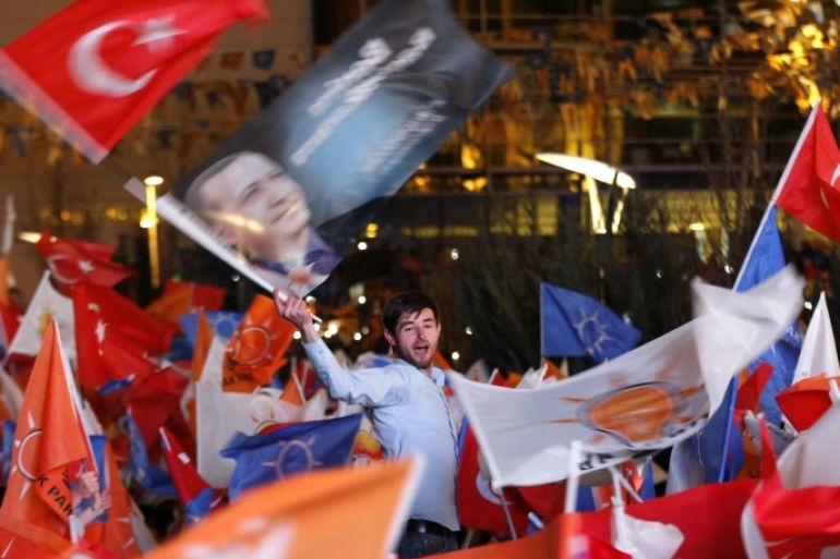 Supporters of Turkey's Prime Minister Tayyip Erdogan celebrate their election victory in front of the party headquarters in Ankara March 31, 2014. REUTERS/Umit Bektas