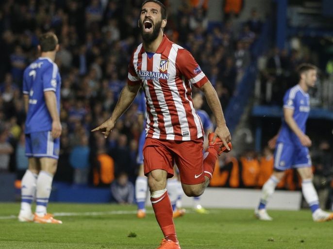 Atletico's Arda Turan celebrates after scoring his soda's 3rd goal during the Champions League semifinal second leg soccer match between Chelsea and Atletico Madrid at Stamford Bridge Stadium in London Wednesday, April 30, 2014. (AP Photo/Kirsty Wigglesworth)