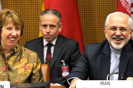 epa04204691 EU High Representative for Foreign Affairs Catherine Ashton (L) and Iranian Foreign Minister Mohammad Javad Zarif (R) smile prior to talks between the E3+3 (France, Germany, UK, China, Russia and US) and Iran, in Vienna,