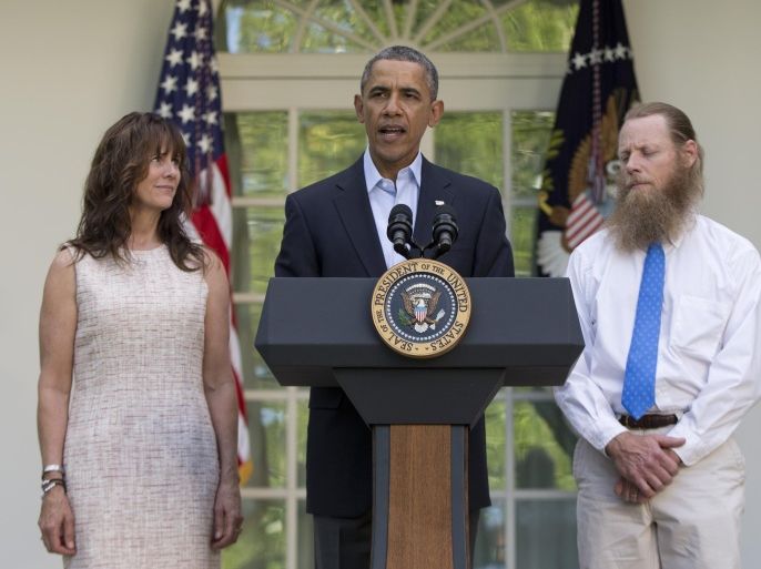 President Barack Obama speaks with Jani Bergdahl, left, and Bob Bergdahl, right, the parents of U.S. Army Sgt. Bowe Bergdahl, in the Rose Garden of the White House in Washington, Saturday, May 31, 2014, after the announcement that Bowe Bergdahl has been released from captivity. Bergdahl, 28, had been held prisoner by the Taliban since June 30, 2009. He was handed over to U.S. special forces by the Taliban in exchange for the release of five Afghan detainees held by the United States. (AP Photo/Carolyn Kaster)