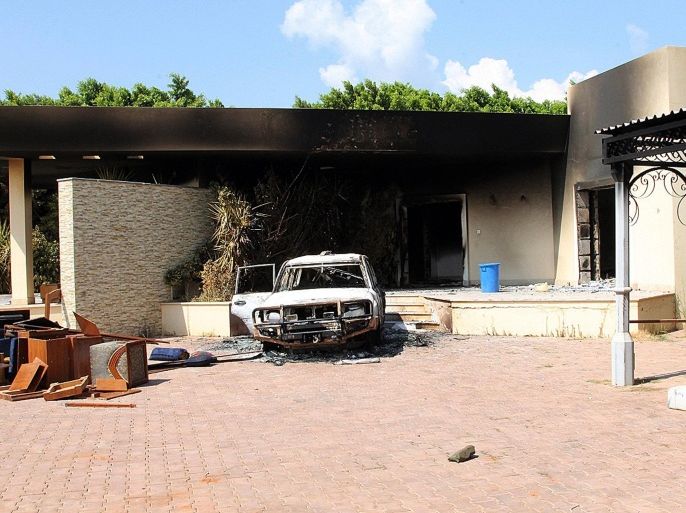 This file photo taken on September 12, 2012 shows a burnt house and a car inside the US embassy compound in Benghazi following an overnight attack on the building. A long-awaited inquiry into a deadly militant attack on the US mission in the Libyan city of Benghazi late on December 18, 2012 slammed State Department security arrangements there as 'grossly inadequate.' But the months-long probe also found there had been 'no immediate, specific' intelligence of a threat against the mission, which was overrun on September 11 by dozens of heavily armed militants who killed four Americans.
