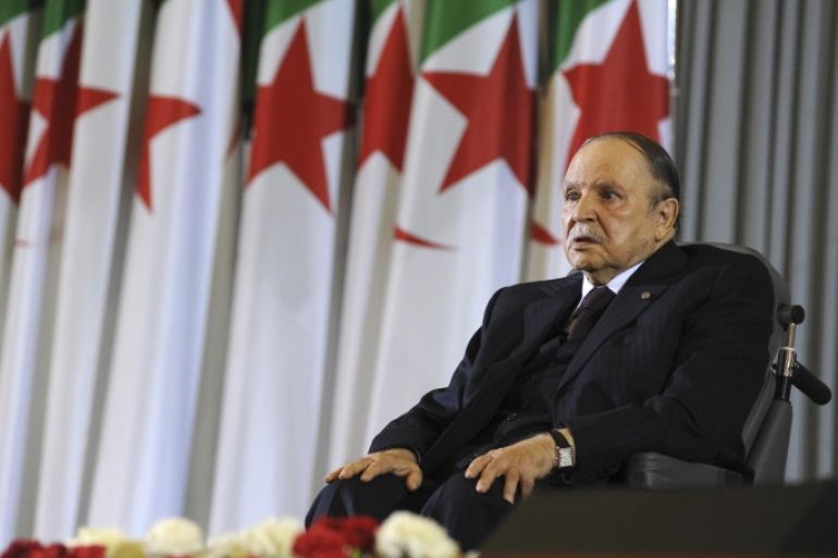Algerian President Abdelaziz Bouteflika sits on a wheelchair after taking oath as President, Monday, April 28, 2014, in Algiers. Algeria's president has taken his oath of office for a fourth term from his wheelchair following his election win earlier this month. The president, in power since 1999, received more than 81 percent of the vote in the April 17 election in this key North African energy producer. (AP Photo/Sidali Djarboub)