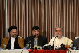 Afghan presidential candidate Abdullah Abdullah (2nd R) speaks during a joint press conference with presidential candidate Gul Agha Shirzai (2nd L) in Kabul on May 3, 2014. A former Afghan warlord nicknamed 'the bulldozer' joined front-runner Abdullah Abdullah's presidential campaign on May 3, as deal-making hots up before the decisive run-off vote next month. AFP PHOTO/Wakil Kohsar