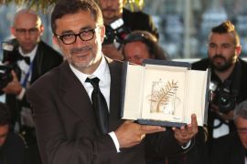 Director Nuri Bilge Ceylan poses with the Palme d'Or award for the film Winter Sleep during a photo call following the awards ceremony at the 67th international film festival, Cannes, southern France, Saturday, May 24, 2014. (Photo by Joel Ryan/Invision/AP)