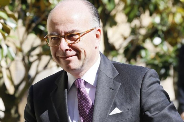 French Interior minister Bernard Cazeneuve arrives at the hotel Matignon before a cabinet meeting, on May,15, 2014 in Paris. AFP PHOTO / PATRICK KOVARIK