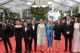 Jury members from left, Willem Dafoe, Jeon Do-yeon, Jia Zhangke, Gael Garcia Bernal, Leila Hatami, jury president Jane Campion, Sofia Coppola,Nicolas Winding Refn and Carole Bouquet pose for photographers as they arrive for the opening ceremony and the screening of Grace of Monaco at the 67th international film festival, Cannes, southern France, Wednesday, May 14, 2014. (AP Photo/Thibault Camus)