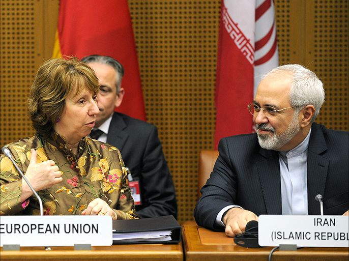 epa04204687 EU High Representative for Foreign Affairs Catherine Ashton (L) and Iranian Foreign Minister Mohammad Javad Zarif (R) chat prior to talks between the E3+3 (France, Germany, UK, China, Russia and US) and Iran, in Vienna,