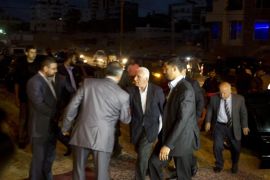 The head of the delegation of the Palestine Liberation Organisation (PLO) and senior figure in the mainstream Fatah party of president Mahmud Abbas Azzam al-Ahmad (C) arrives rive to attend a meeting with Hamas deputy leader Musa Abu Marzuk (unseen) in Gaza City on, May 13, 2014. AFP PHOTO /MAHMUD HAMS