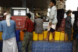 Yemenis line up in a queue with their jerry cans at a petrol station amid fuel shortages in Sanaa, Yemen, Wednesday, May 14, 2014. A shortage of fuel supplies hit Yemen's capital Sanaa and caused a fuel crisis and created long lines of cars queues at gas stations. (AP Photo/Hani Mohammed)