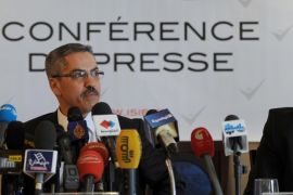 The President of the Independent Higher Authority for the Elections (ISIE), Shafik Sarsar (L) gives a press conference with ISIE member Riadh Bouhouch on May 27, 2014 in Tunis. The body responsible for organizing general elections by the end of the year in Tunisia urged politicians to agree on the election date as soon as possible, noting that otherwise these crucial elections for the country might be postponed. AFP PHOTO / FETHI BELAID