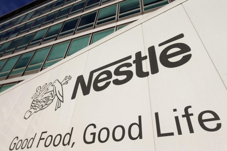 The Nestle logo is pictured on a truck outside the company's headquarters before the nine-month sale figures news conference in Vevey October 17, 2013. REUTERS/Denis Balibouse