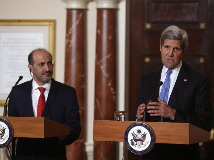 Secretary of State John Kerry and Ahmad al-Jarba, president of Syria's main opposition bloc, speak to reporters at the State Department in Washington, Thursday, May 8, 2014. In addition to speaking about Syria, Kerry commented on the situation of kidnapped school girls in Nigeria. (AP Photo/Charles Dharapak)