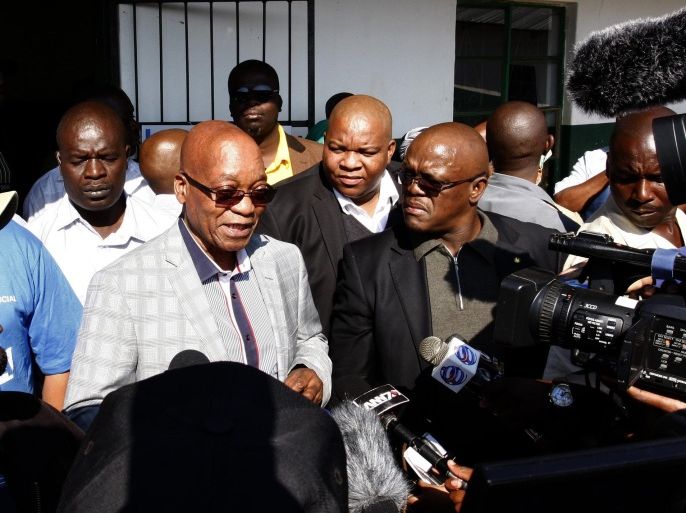 South African president and leader of the African National Congress (ANC) Jacob Zuma, center, speaks to the press after casting his vote in Ntolwane, rural KwaZulu Natal province South Africa, Wednesday May, 7, 2014. The country goes to the polls in the fifth democratic elections since the end of apartheid in 1994. (AP Photo) SOUTH AFRICA OUT