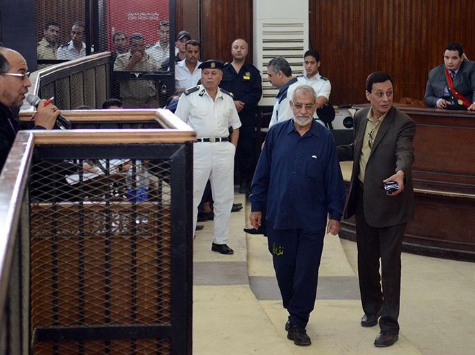 Egyptian Brotherhood's supreme guide Mohamed Badie (C) attends his trial in the capital Cairo on May 18, 2014. An Egyptian court today sentenced 126 supporters of ousted Islamist president Mohamed Morsi to 10 years in prison each over protest violence, judicial sources said. AFP