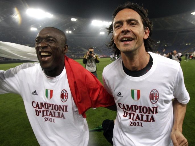 FILE -- In this file photo taken on May 7, 2011, AC Milan's Clarence Seedorf, left, and Filippo Inzaghi celebrate after the Serie A soccer match between AS Roma and AC Milan at Rome's Olympic stadium. Real Madrid's Champions League winning coach, Carlo Ancelotti, has backed former player Filippo Inzaghi as the ideal candidate to take over as manager of AC Milan.Current Milan coach Clarence Seedorf is only four months into a 2 ½ year contract, but Italian media reports claim that club owner Silvio Berlusconi has already decided to replace him with the Dutchman's former teammate, Inzaghi. (AP Photo/Pier Paolo Cito)