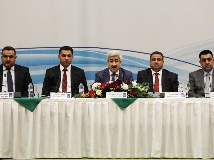 Sarbast Mustafa, center, chairman of the Independent High Electoral Commission of Iraq, and his colleagues release the results of the country’s parliamentary elections in Baghdad, Iraq, Monday, May 19, 2014. A coalition led by Iraq’s Shiite prime minister emerged Monday as the biggest winner in the country’s first parliamentary elections since the U.S. military withdrawal in 2011, electoral officials said, as the embattled premier is seeking a third term in office despite political turmoil and rising violence. (AP Photo/ Khalid Mohammed)