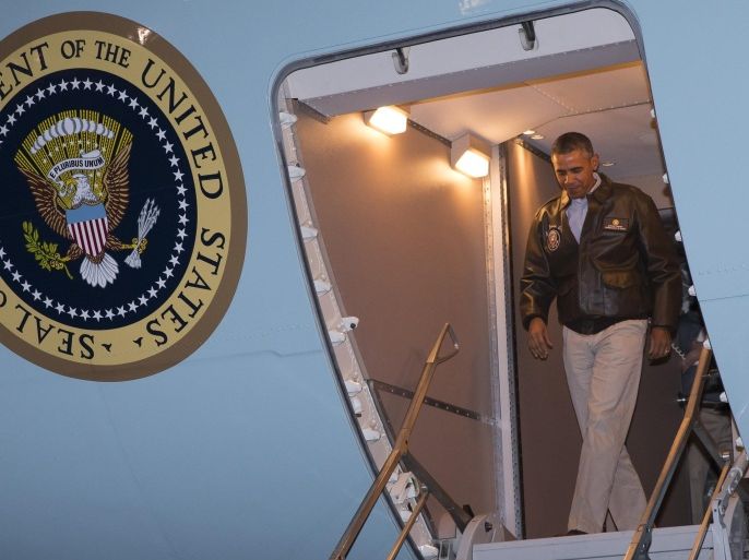 President Barack Obama steps off Air Force One after arriving at Bagram Air Field for an unannounced visit, on Sunday, May 25, 2014, north of Kabul, Afghanistan. (AP Photo/ Evan Vucci)