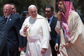 In this photo provided by the Vatican newspaper L'Osservatore Romano, Pope Francis is welcomed upon his arrival in Amman, Jordan, Saturday, May 24, 2014. (AP Photo/L'Osservatore Romano, ho)