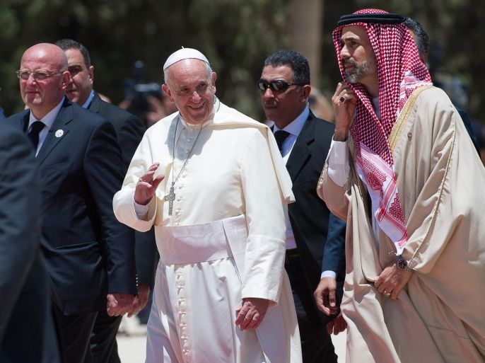 In this photo provided by the Vatican newspaper L'Osservatore Romano, Pope Francis is welcomed upon his arrival in Amman, Jordan, Saturday, May 24, 2014. (AP Photo/L'Osservatore Romano, ho)