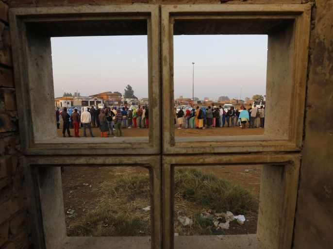 Some of the hundreds of people stand in line to cast their vote at a polling station in Bekkersdal, Johannesburg, South Africa, 07 May 2014. South Africans started voting in general elections expected to keep the ruling African National Congress in power, even if polls said it could lose votes over corruption and enduring poverty. About 25 million people were eligible to vote in the elections.