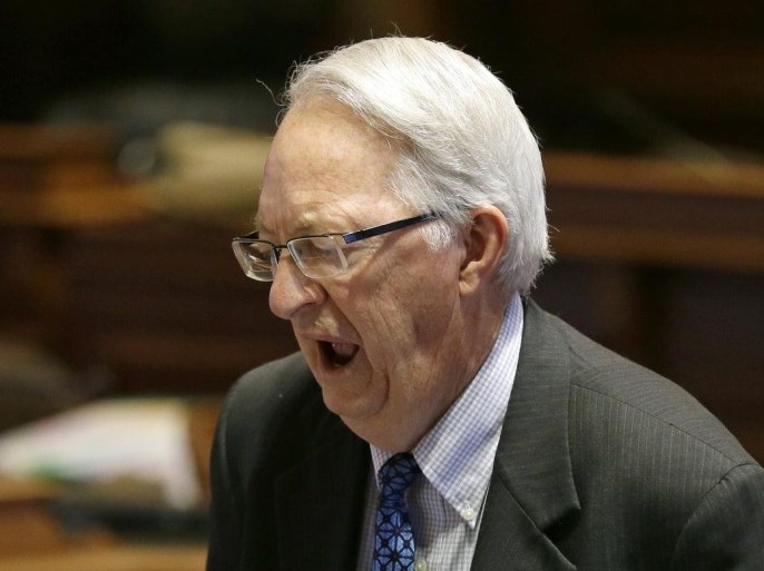 Sen. Dennis Black, D-Grinnell, lets out a yawn as he talks with Sen. Bill Dotzler, D-Waterloo, left, on the floor of the Senate, Thursday, May 1, 2014, at the Statehouse in Des Moines, Iowa. The Iowa Senate, after working all night to finish the 2014 legislative session, must return for one more day after a dispute developed involving subpoena powers. (AP Photo/Charlie Neibergall)