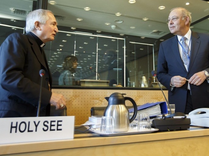 Archbishop Silvano M. Tomasi, (L), Apostolic Nuncio, Permanent Observer of the Holy See (Vatican) to the Office of the United Nations in Geneva, speaks with Claudio Grossmann, (R), Chairperson of UN Committee against Torture, prior to the UN torture committee hearing on the Vatican, at the headquarters of the office of the High Commissioner for Human Rights (OHCHR) in the Palais Wilson, in Geneva, Switzerland, 05 May 2014. The UN Committee Against Torture hears the Holy See for the first time to consider whether the church's handling of child sexual abuse complaints has violated its obligations against subjecting minors to torture and to hear the Vatican on its efforts to stamp out child sex abuse by priests.