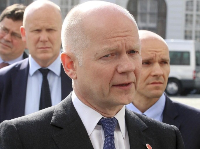 British Foreign Secretary William Hague talks to the press as he arrives for talks at the European Council in Vienna, Austria, Tuesday, May 6, 2014. (AP Photo/Ronald Zak)