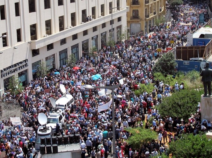 A general view shows thousands of public sector employees and teachers staging a protest dubbed as “day of rage,” in downtown Beirut, Lebanon, on Wednesday, May 14, 2014, as Parliament discusses a controversial wage scale. Civil servants and public and private school teachers were also on strike Wednesday to pressure lawmakers to adopt a recommendations for wage hikes. (AP Photo/Zeina Karam)
