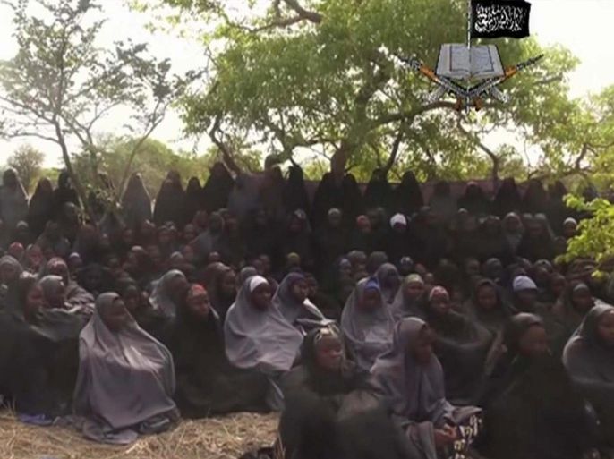 In this photo taken from video by Nigeria's Boko Haram terrorist network, Monday May 12, 2014 shows the alleged missing girls abducted from the northeastern town of Chibok. The new video purports to show dozens of abducted schoolgirls, covered in jihab and praying in Arabic. It is the first public sight of the girls since more than 300 were kidnapped from a northeastern school the night of April 14 exactly four weeks ago. (AP Photo)